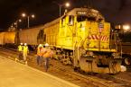 People from the Department of Ecology inspect the damage from the derailed cargo train on June 20. Photo by David Rosen