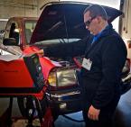 Ben Slenning goes over readings on a Vat 40 to determine if the car battery works properly when the vehicle starts up. Photo by David Rosen