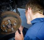 Rob Zolotnyuk does an inspection and takes measurements on a brake rotor to determine its thickness. Photo by David Rosen