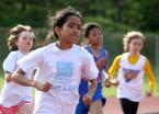 Runners round the corner in the 400 meter run.