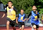 The 100 meter dash shows the concentration on the faces of these runners.