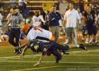 Rainier Beach defensive lineman Ruben Purganan #71 is taken down by Wildcat quarterback Jamie Maples after Maples is intercepted by Purganan. Photo by Greg McCorkle