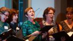 Lyn Kratz, center, and fellow members of the Fauntleroy Women's Singers lift their voices for 'O Be Joyful.' Photo by Ben Ackers