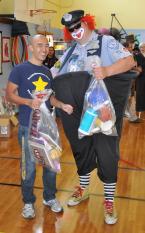 Roxhill teacher Mike Nugyen and a Seafair clown. Photo by Geoff Miller of Roxhill Elementary
