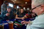 Dave and Emi were having fun at the West Seattle Herald table with dealer Dick Sherman. Photo by Patrick Robinson
