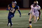 West Seattle running back Rico Saeteurn is pursued by Highline Pirate Malik White. Photo by Paul Moseley