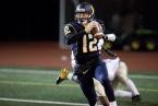 West Seattle Quarterback Carter Golgart scrambles in a game against Highline. Photo by Paul Moseley