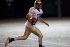 Highline receiver AJ Sailiai looks back as he rushes for a touchdown against West Seattle. Photo by Paul Moseley