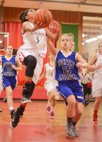 Shorewood Christian’s Rosie Young (3) goes in for the lay-up in the first quarter. Photo by Anastasia Stepankowsky.