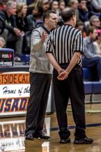 West Seattle Head Coach Keffrey Fazio argues a call with the referee in a district tournament game against Eastside Catholic.