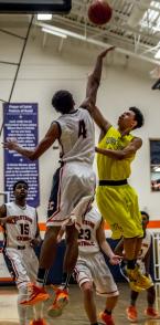 Nate Pryor Shoots as Eastside Catholic’s Matisse Thybulle challenges in a district tournament game.  Pryor was the high scorer for West Seattle with 21 points.  Thybulle was the game high scorer with 32 points.