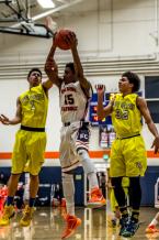 Eastside Catholic guard Mandrell Worthy grabs a rebound in a district tournament game with West Seatle.  Worthy had 13 points in the Eastside Catholic victory.