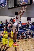 Eastside Catholic star Matisse Thybulle makes a gymnastic shot in a victory over West Seattle.  Eastside Catholic won the district tournament game 79-56 and were led by Thybulle’s 32 points.
