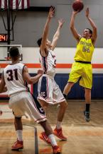 Carter Golgart shoots in a district tournament game against Eastside Catholic. Golgart had 4 points before leaving the game with an injury.