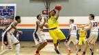 Andre Moore drives in a district tournament game against Eastside Catholic.  Moore had 15 points in the game including three 3-pointers.