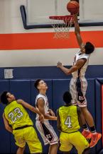 Matisse Thybulle skys over the West Seattle defense has he leads Eastside Catholic to a 79-56 district tournament win.  Thybulle was the game high scorer with 32 points.