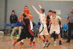 The Lions' Matt Munson, playing hands-up,good defense, with Jovi Fevaleaki (left) and Spencer Howell, both, back, playing the good 'D' too.  Photo by Ed Shepherd