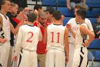 Lions' coach, Alfonso Gonzales, is talking to players on his team during a timeout against Neah Bay. Photo by Ed Shepherd