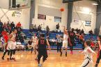 The Lions' Stan Domingo is taking a shot and it looks like a Neah Bay player is  fouling him on the play.  Photo by Ed Shepherd