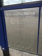 Featured in the shelters are pages of the West Seattle Herald from our archives