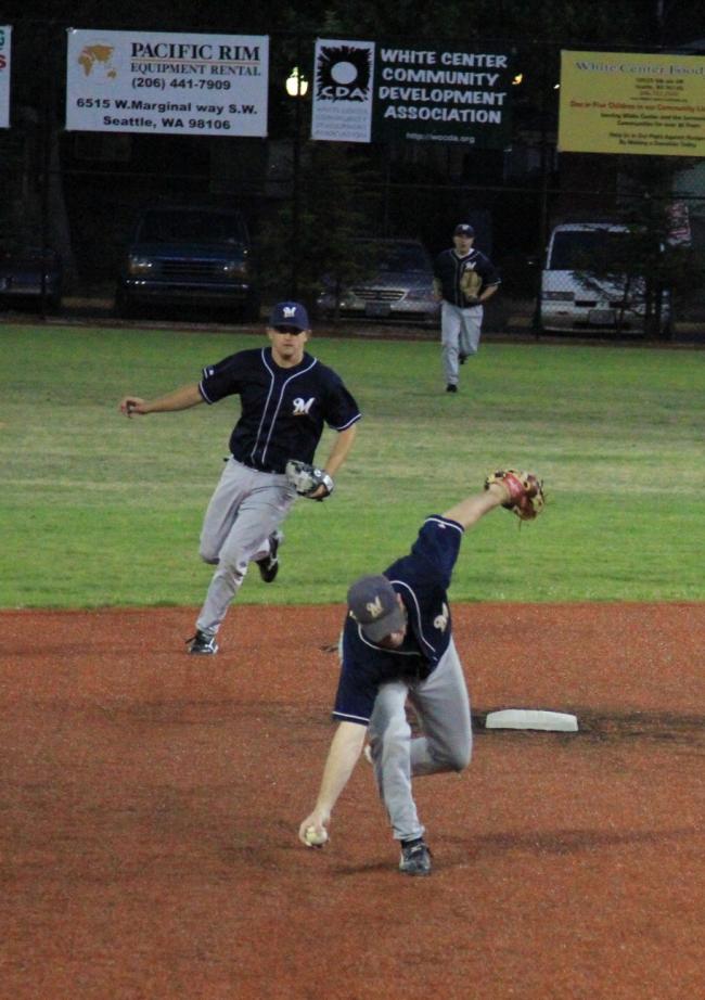 Brewers 2nd baseman makes bare handed grab.JPG