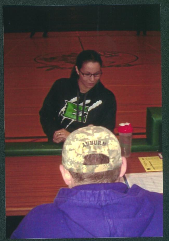 Evergreen girls basketball coach Natasha Hicks McCray checks in at the scorers table at Auburn High School