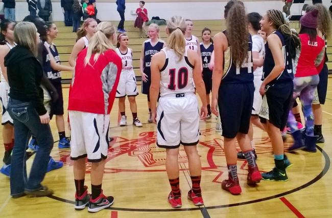 Seattle Christian and Auburn Adventist in a post game prayer.